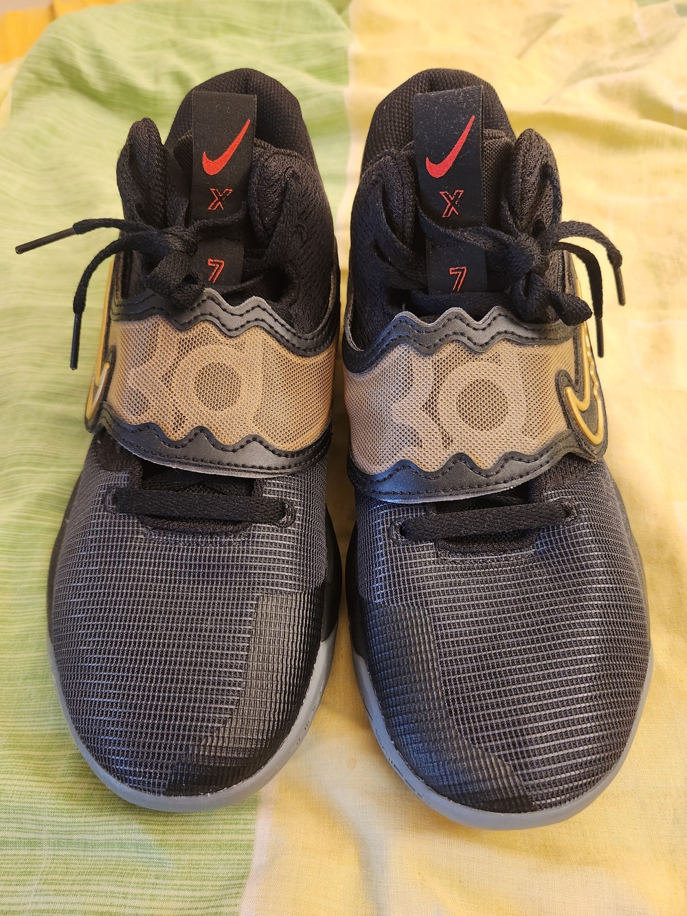 Nike Black and Gold Basketball Sneakers with Red Accents